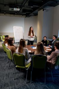 business conference or meeting at the hotel the girl on the flipchart shows the development plan